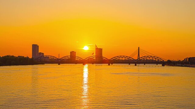 Daugava river cable stayed Vansu bridge sunset Riga Latvia timelapse