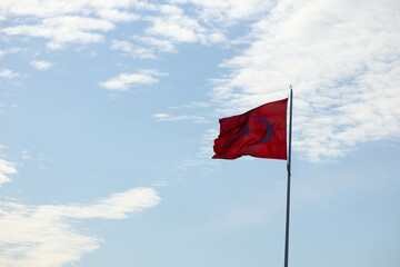 beautiful turkish red flag on the blue sky background