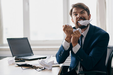 manager working for a laptop in the office emotions discontent official