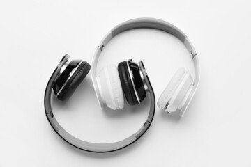 Fototapeta na wymiar Different modern headphones on white background