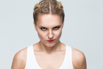 Young Caycasian Angry Blond Woman Posing Against White Background