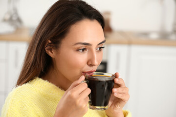 Morning of beautiful woman drinking coffee at home