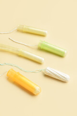 Menstrual tampons on yellow background