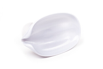 on a white background. silver soap dish, in the shape of a droplet. close-up.