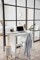Modern workplace in studio apartment