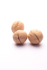 walnuts in the peel close-up on a white background isolated