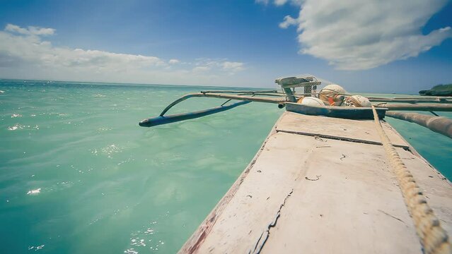 Bangka Boat Floating over Turquise Sea