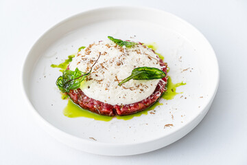 beef tartar with sauce and herbs