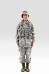 African-American female soldier on light background