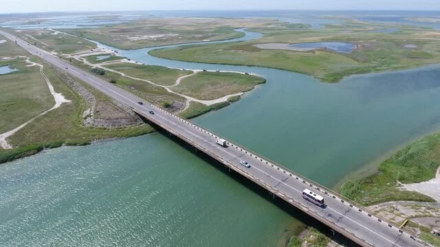 Aerial shot of modern highway bridge on Arabat arrow on sunny day in summer