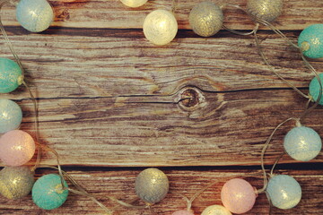 Colorful LED cotton ball decorative on woode background