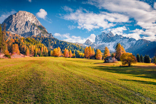 Photography of mountain valley. Majestic autumn view of Durrenstein peak. Colorful morning scene of Dolomite Alps, Province of Bolzano - South Tyrol, Itale. Beauty of nature concept background.