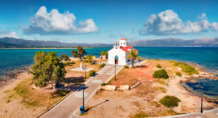 Photography of Saint Spiridon church in Elafonisos port. Captivating morning seascape of...