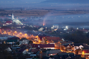 Obraz premium Smoke over rural landscape.