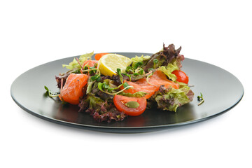 Tasty salad with salmon and lemon in plate on white background