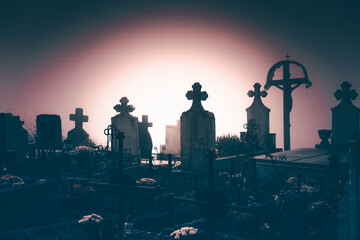 Fototapeta na wymiar Old creepy graveyard in mist. Halloween background