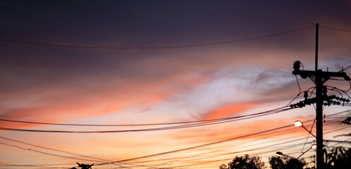 orange sky with electric poles sunset silhouette womtone