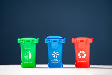 Set of bins for the selective collection of waste (glass, paper, metal and plastic) for recycling purposes