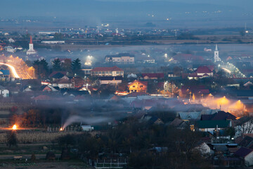 Obraz premium Smoke over rural landscape.
