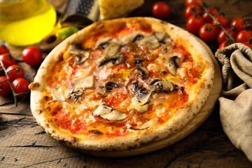 Traditional homemade pizza with mushroom and ham