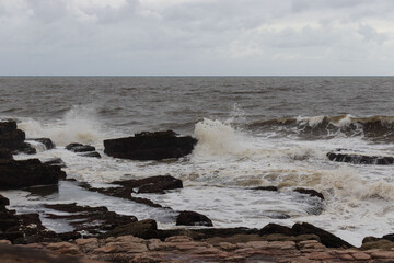 A view of the sea on a embankment of rocks
