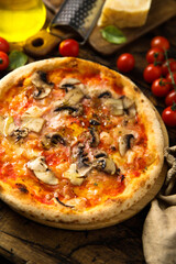 Traditional homemade pizza with mushroom and ham