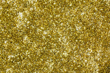 Christmas background with gifts, gold ribbon and gold Christmas decorations, glitter. Christmas background, top view. Copy space.