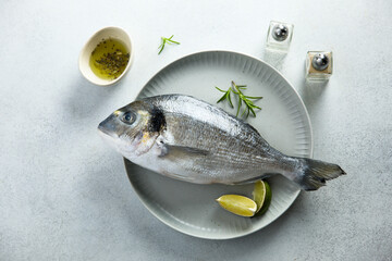Raw sea bream on a plate