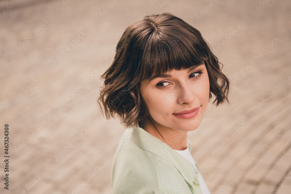 Wall mural Profile side view portrait of attractive dreamy brown-haired girl spending day vacation traveling abroad outdoors