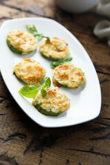 Roasted courgette with cheese and herbs