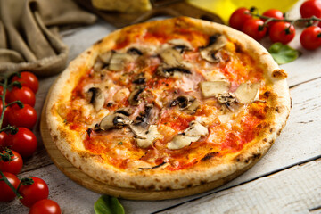 Traditional homemade pizza with mushroom and ham