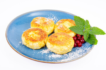Sweet cottage cheese pancakes on plate, dairy products. Studio Photo.