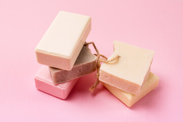 Variety of Natural Soaps on Pink Background Handmade Organic Soaps Horizontal Flat Lay