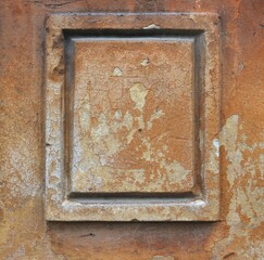 Framed rectangular blank surface fom a weathered wall of an ancient creepy mansion - peeling brown painting and cracks texture for a background