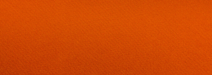 Orange textured art paper surface with gradient. Classic elegant long background for design and text