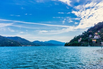 Obraz premium View on Lago Maggiore with blue sky and mountains in the background, Italy