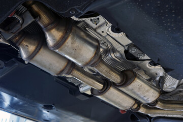 A catalytic converter (catalyst) installed on a modern car. Equipment for reducing harmful...