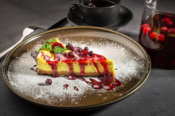Cheesecake topped with fruit jam, delicious cheesecake with currant jam