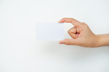 Obraz premium a right hand holds an empty white space on a white background. a card mockup that is suitable for business or identity mockup use.