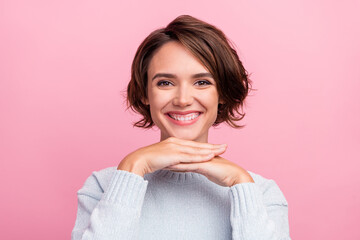 Photo of charming happy young woman hold hand face good mood clinic whitening teeth isolated on pink color background