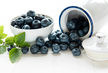 Blueberries on white tile  background