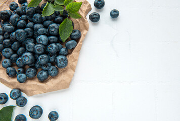 Blueberries on white tile  background