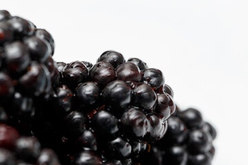 Ripe fresh blackberries, an abstract background of blackberries. Top view. Close-up. Macro. Blackberry berries with water drops. Flat lay. Useful forest fruits. Super food. Concept of healthy eating
