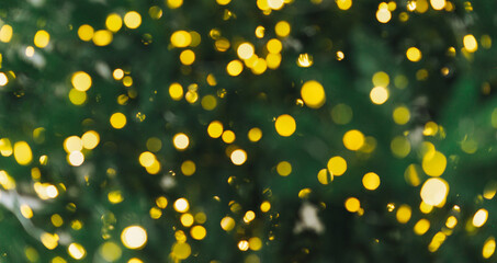 Blurred Decorated Christmas tree banner, yellow bokeh of garland light, new year textured background