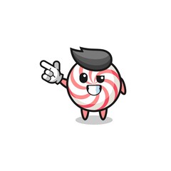 swirl lollipop mascot pointing top left