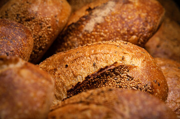 Craft loaves of bread. Fresh hot bread from the oven. Appetizing and healthy food