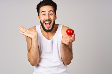 Cheerful man fresh tomatoes healthy lifestyle diet food isolated background