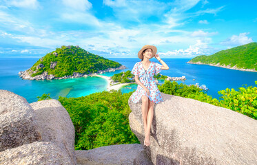 the woman on the rock of Koh Nang Yuan viewpoint, see a beautiful view in summer Scenic seascape...