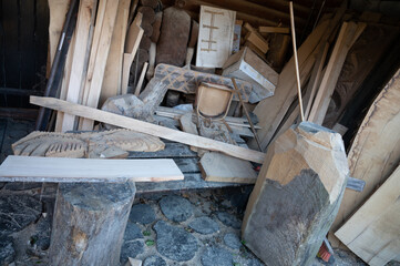 Boards and wood in a carpentry workshop outside. Timber wood blanks at diy workbench. Handcraft hobby