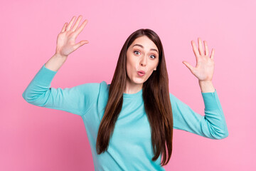 Photo of amazed positive cheerful young woman raise hands good mood sale isolated on pink color background